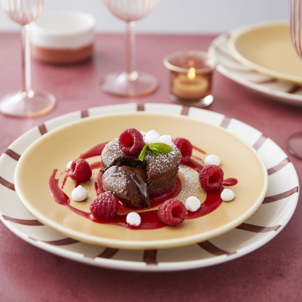chocolate-cupcake-with-dripping-heart-and-raspberry-coulis