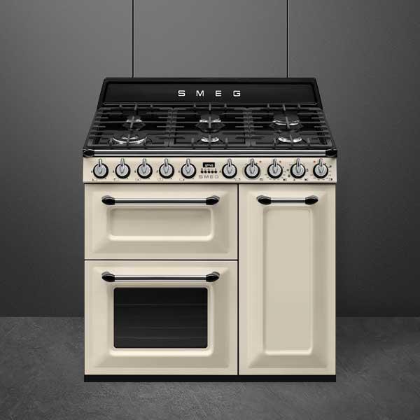 A traditional style, cream range cooker with 3 oven doors and a 6 burner gas hob