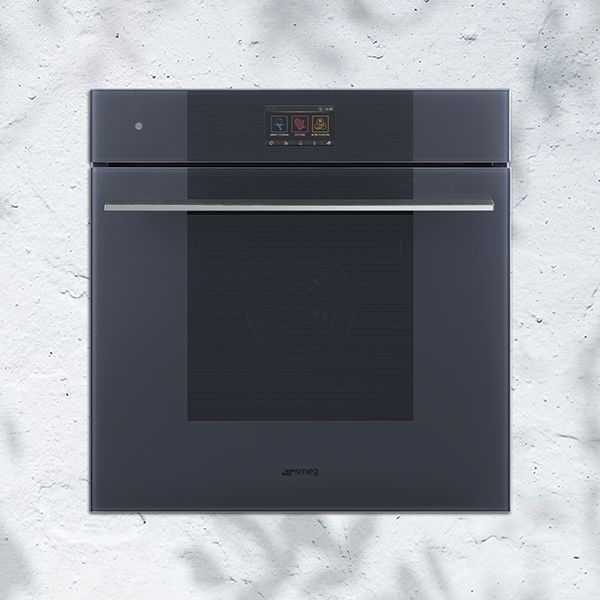 A contemporary range of appliances (shown, is a built-in oven from the range) featuring a minimalistic look in Neptune Grey, with a digital touch control panel