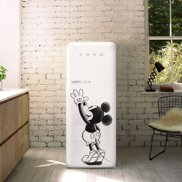 Smeg's iconic retro design fridge in white, featuring Disney's beloved Mickey Mouse on the front door, smiling and laughing