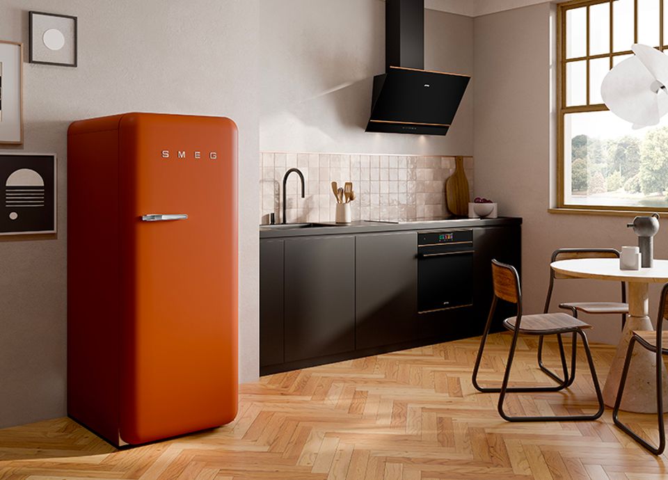 A 50'S style freestanding refrigerator in burnt orange