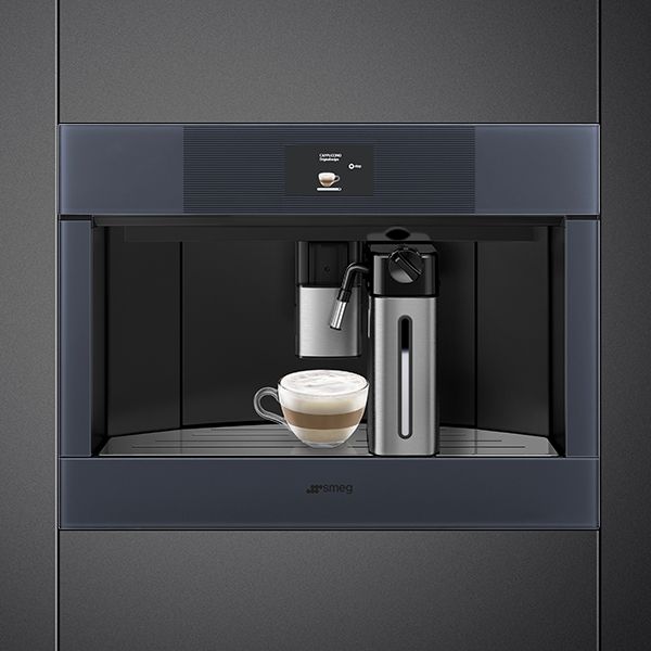 A modern, built-in coffee machine in Neptune grey, with milk foamer and single touch control panel
