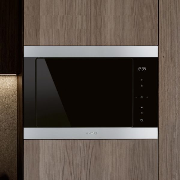 A built-in microwave oven in black with black glass and stainless steel top and bottom surround