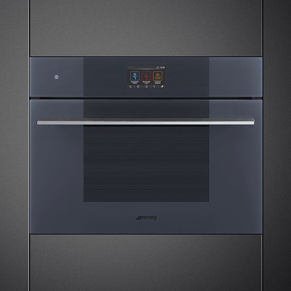 A modern built-in blast chiller in Neptune grey with silver horizontal handle and a single digital touch control unit