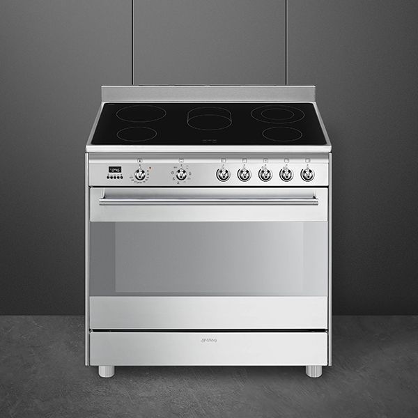 Silver range cooker with a ceramic black hob and chrome controls