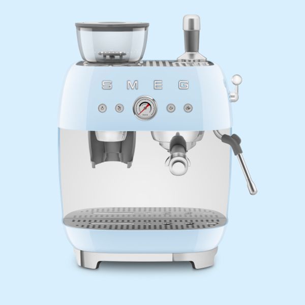 A wide pastel blue, manual espresso coffee machine with grinder, in Smeg's iconic retro design. Also visible is a steam wand and pressure gauge.