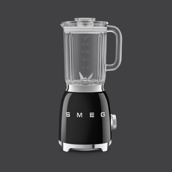 A black blender in Smeg's iconic retro design, featuring chrome highlights and a clear blender container with a handle