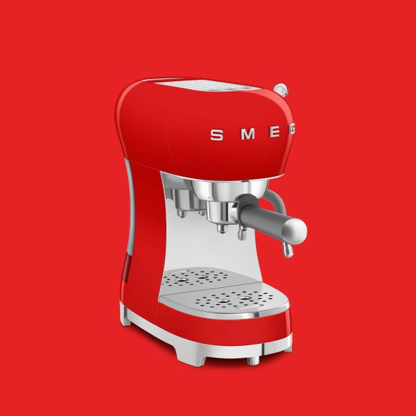 A bright red, manual espresso coffee machine in Smeg's iconic retro design.