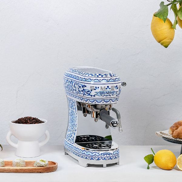 A espresso coffee machine in Smeg's 'Blu mediterraneo' design, reminiscent of traditional blue and white hand painted Italian tiles.