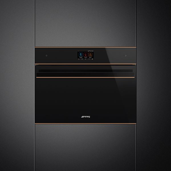 A built-in blast chiller in black with copper trim, featuring Smeg's vitality system